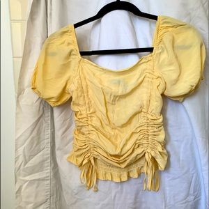 Yellow blouse with puffy shoulders